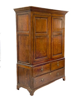 Lot 48 - A George III oak livery cupboard or wardrobe.