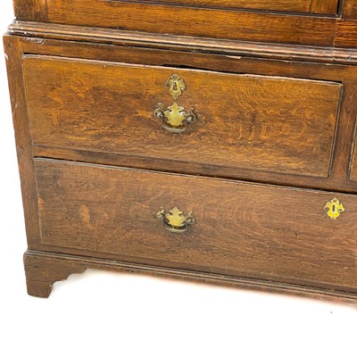 Lot 48 - A George III oak livery cupboard or wardrobe.
