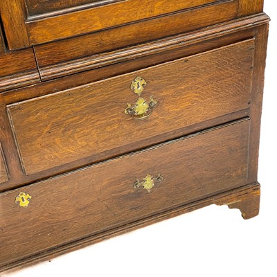 Lot 48 - A George III oak livery cupboard or wardrobe.