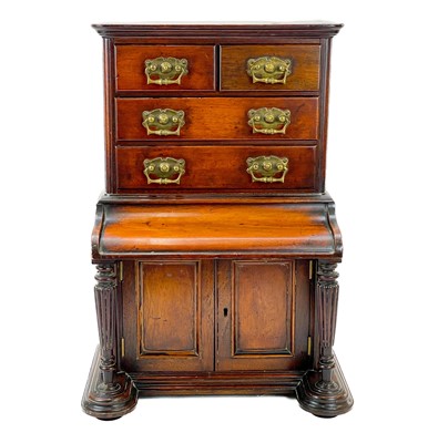 Lot 30 - A late Victorian walnut apprentice type miniature cabinet.