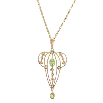 Lot 428 - An Art Nouveau 9ct rose gold peridot and split pearl set openwork pendant.