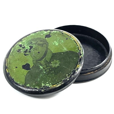 Lot 91 - A George IV lacquered papier mache circular portrait snuff box.
