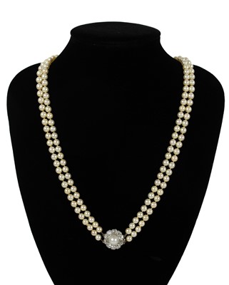Lot 217 - An impressive early 20th century cultured pearl, diamond set, double-row necklace & earrings suite.