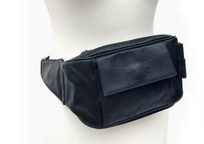 Lot 3080 - A Gucci black leather belt bag. .
