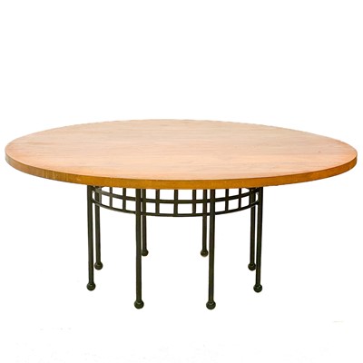 Lot 454 - A large contemporary oak circular dining table.