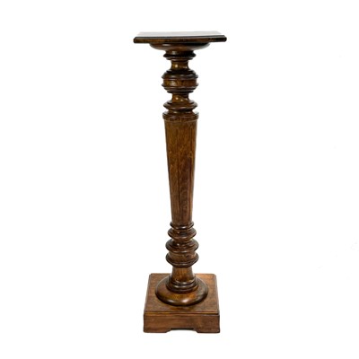 Lot 258 - A stained beech torchere.