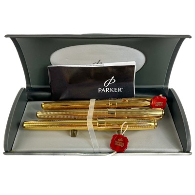 Lot 241 - A cased set of three Parker Sonnet gold-plated pens.