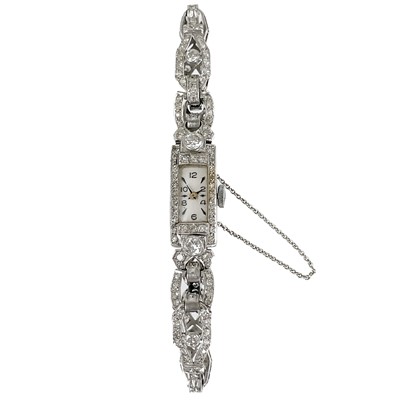 Lot 155 - An Art Deco platinum and diamond lady's cocktail bracelet wristwatch.