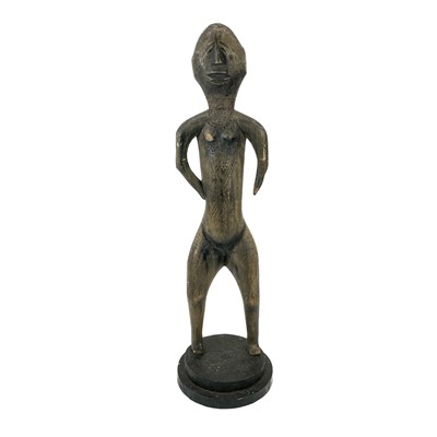 Lot 75 - An African carved tribal female fertility figure.