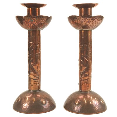 Lot 152 - A pair of Newlyn copper candlesticks.