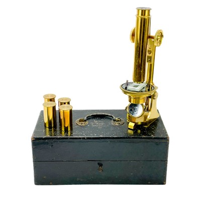 Lot 11 - A late Victorian brass travelling microscope marked Baker London.