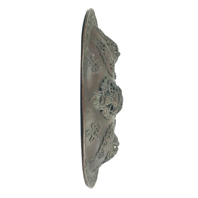 Lot 1118 - A Tibetan ceremonial copper shield, late 19th century.