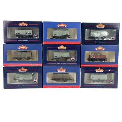 Lot 619 - Bachmann "00" 3 to 9 wooden plank open wagons including tube etc wagons (x32)