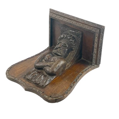 Lot 9 - Two oak misericord or brackets.