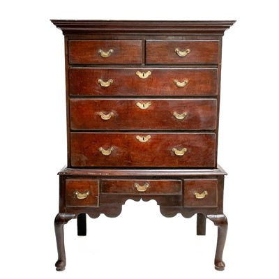 Lot 104 - A George III oak chest on stand.