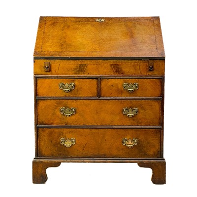 Lot 165 - A walnut and crossbanded bureau.