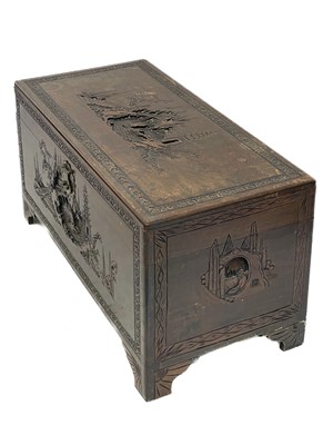 Lot 414 - A Chinese carved camphor wood chest.