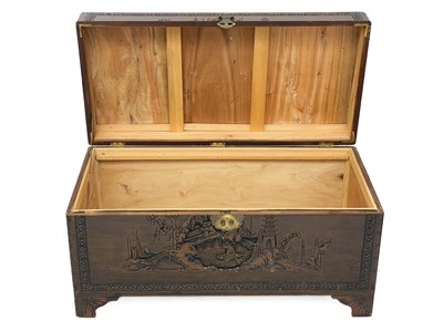 Lot 414 - A Chinese carved camphor wood chest.