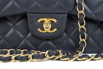 Lot 577 - A Chanel Maxi navy blue caviar leather handbag.