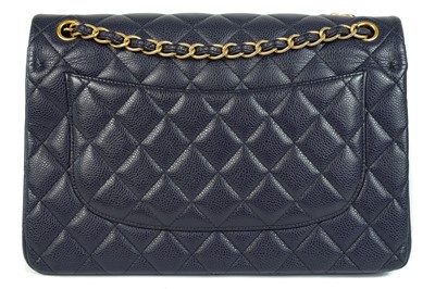 Lot 577 - A Chanel Maxi navy blue caviar leather handbag.