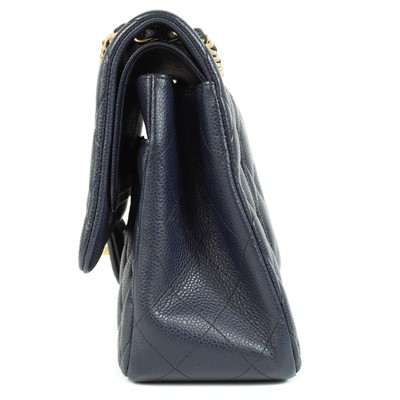 Lot 577 - A Chanel Maxi navy blue caviar leather handbag.