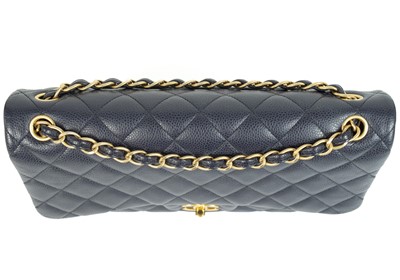 Lot 577 - A Chanel Maxi navy blue caviar leather handbag.