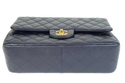 Lot 577 - A Chanel Maxi navy blue caviar leather handbag.