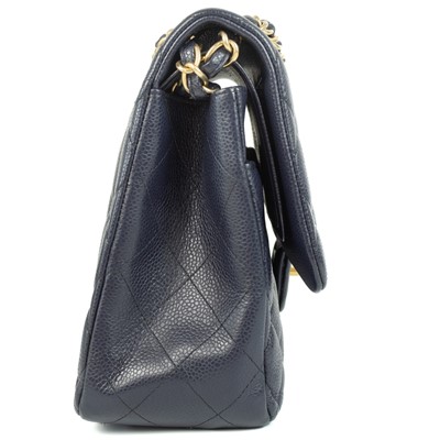 Lot 577 - A Chanel Maxi navy blue caviar leather handbag.