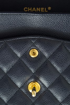 Lot 577 - A Chanel Maxi navy blue caviar leather handbag.