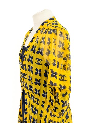 Lot 570 - A Chanel yellow and black silk dress and navy blue blouse.