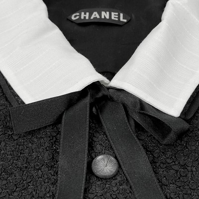 Lot 23 - A Chanel 1960's black and white chenille fabric vintage jacket.