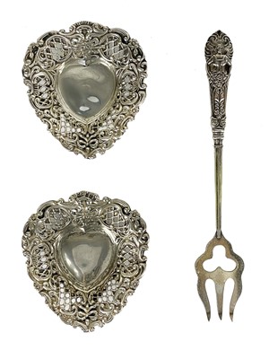 Lot 161 - A pair of Edwardian silver heart-shaped bonbon dishes by Henry Matthews.