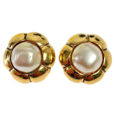 Lot 608 - A pair of Chanel gold-tone faux pearl clip earrings.