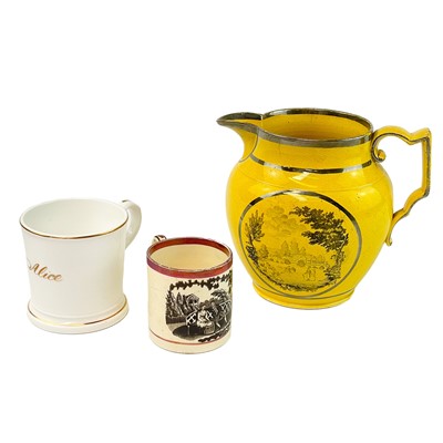 Lot 241 - A canary yellow and silver lustre jug.