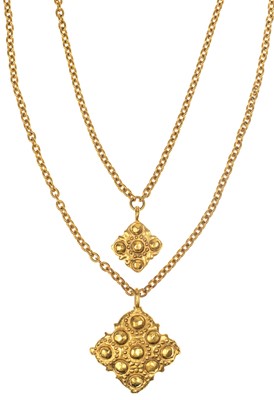 Lot 603 - A Chanel double strand and medallion gold-tone necklace.