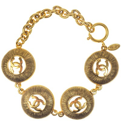 Lot 617 - A Chanel gold-tone CC medallion bracelet.