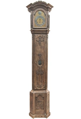 Lot 139 - A late 19th century French provincial oak carved longcase clock.