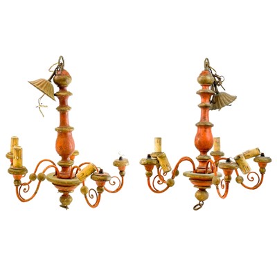 Lot 102 - A pair of painted and gilt wood five branch chandeliers.