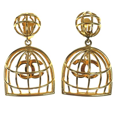 Lot 569 - A pair of Chanel CC birdcage gold-tone pendant earrings.