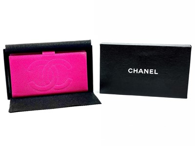 Lot 560 - A Chanel Fuchsia caviar leather wallet.