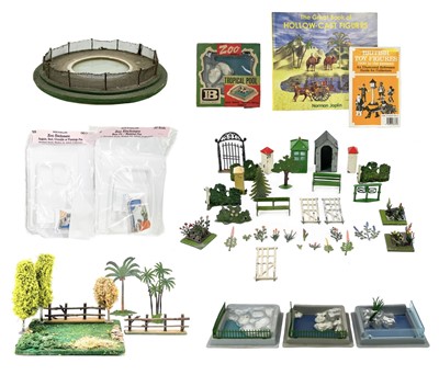 Lot 876 - Lead and plastic zoo and garden accessories and lead reference books.