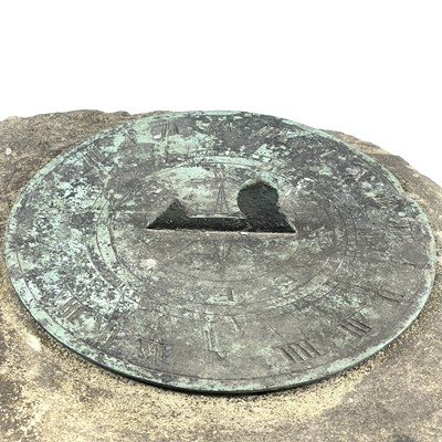 Lot 365 - A bronze sundial on a sandstone plinth.