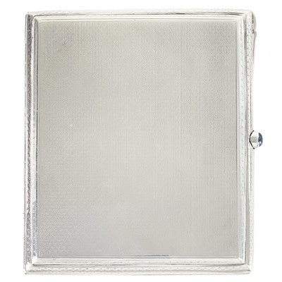 Lot 149 - A continental silver 1920's engine turned cigarette case with a sapphire cabochon button.