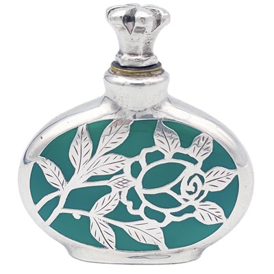 Lot 151 - An Edwardian silver overlay green opaque glass snuff bottle.