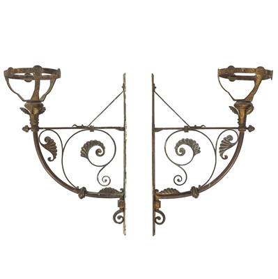 Lot 82 - A pair of late Victorian brass oil lamp wall brackets.