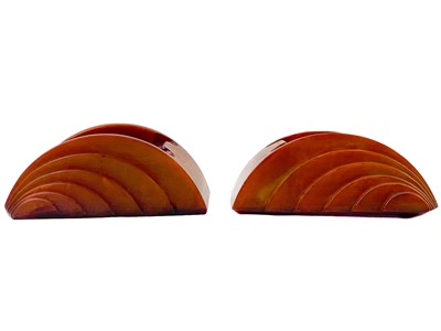 Lot 140 - Two Carvacraft butterscotch amber colour ashtrays.