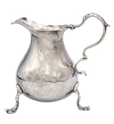 Lot 124 - A George II silver baluster cream jug.