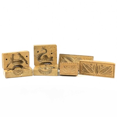 Lot 78 - A dolphin treen butter mould in two parts.