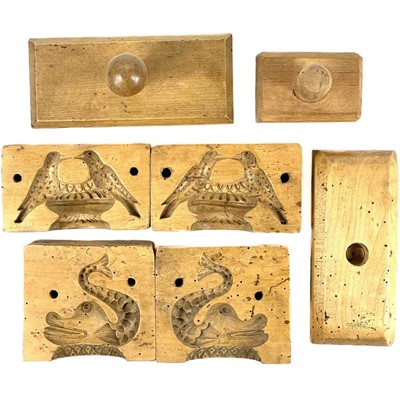 Lot 78 - A dolphin treen butter mould in two parts.