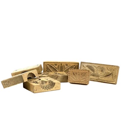 Lot 78 - A dolphin treen butter mould in two parts.